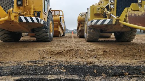 Construction vehicles on field 