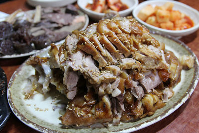 Focus on the korean style braised pork belly with the side dishes at korean restaurant, seoul