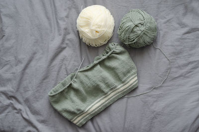 High angle view of shoe on bed