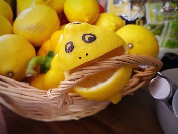 Close-up of lemons on wooden table