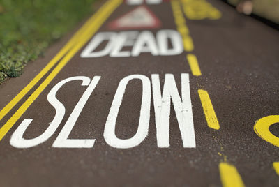 High angle view of arrow sign on road