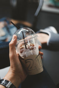 Midsection of person drinking glass