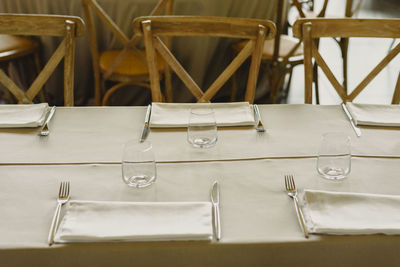 Close-up of empty seats on table in restaurant