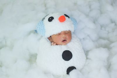 A baby girl as a snowman