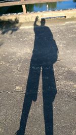 High angle view of shadow on man