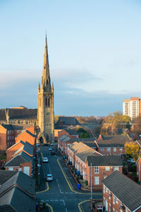 High angle view of buildings in city against sky