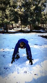 Man swimming in winter