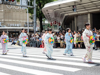 People walking on street in city