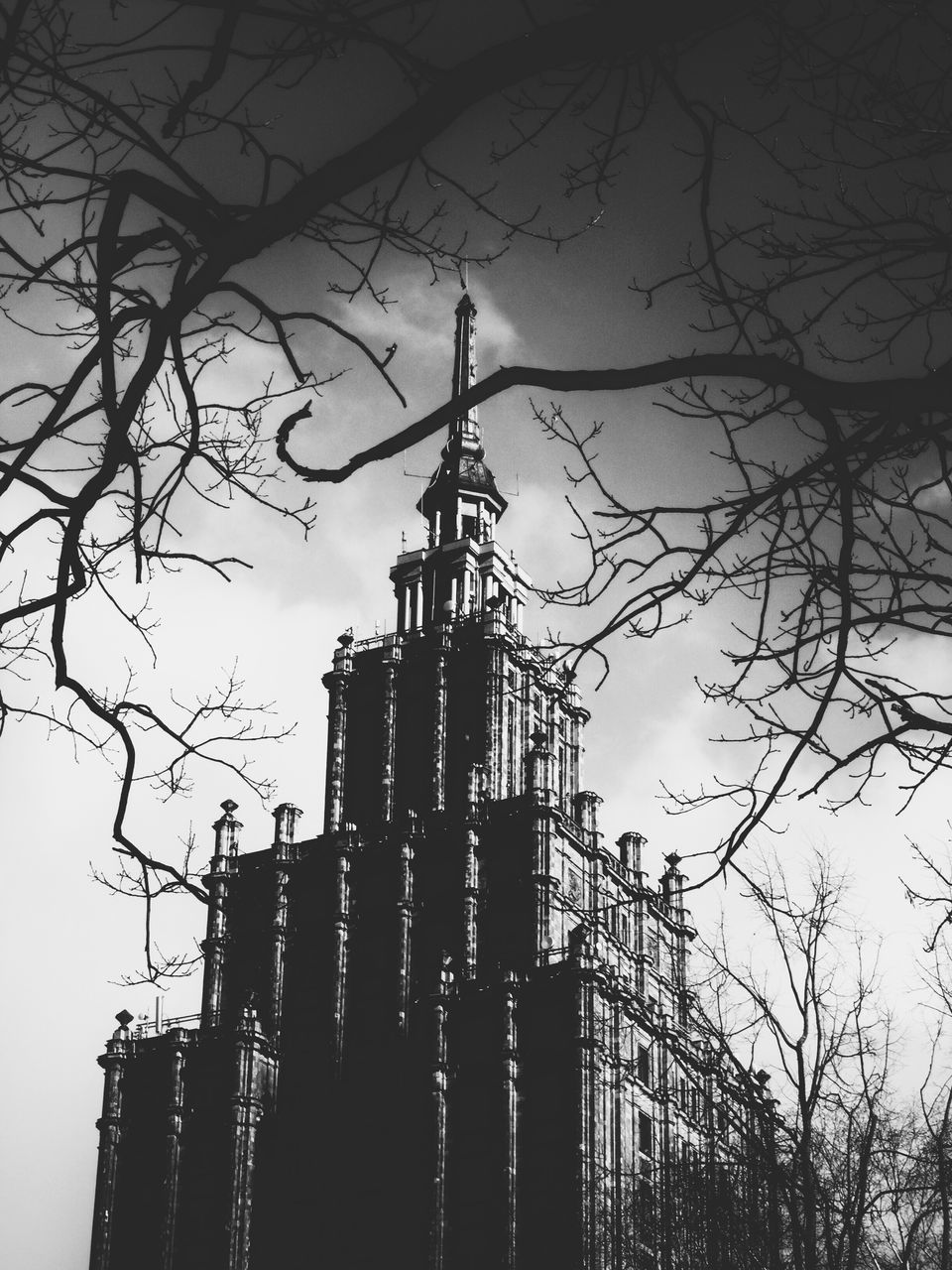 LOW ANGLE VIEW OF SILHOUETTE OF TOWER AGAINST SKY