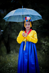 Portrait of woman with umbrella