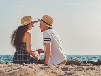 Happy couple at beach during picnic
