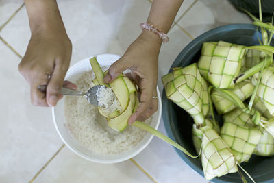 High angle view of woman preparing food in bowl