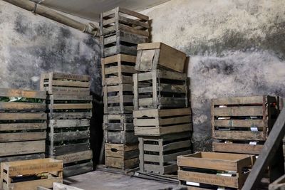Stack of old wooden containers at abandoned warehouse
