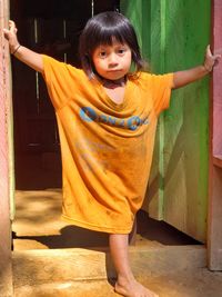 Portrait of smiling girl standing outdoors