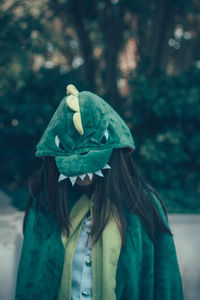 Woman wearing animal costume while standing in park