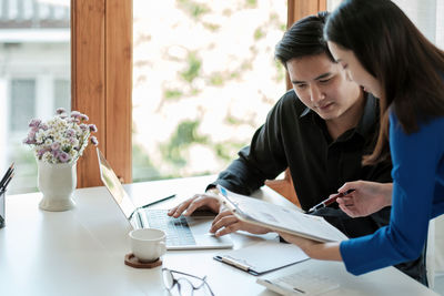 Business colleagues working at office