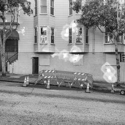 Cars on street by buildings in city