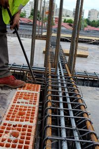 Low section of man working at construction site