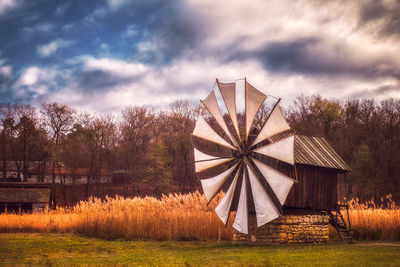 Built structure on field against sky