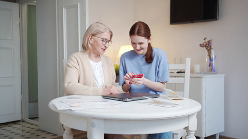 Portrait of young woman working at home