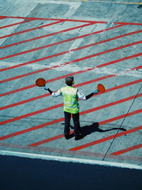 Full length of man standing on road