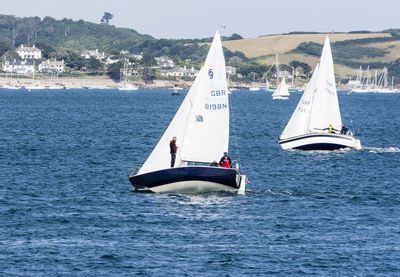 People enjoying boat in sea