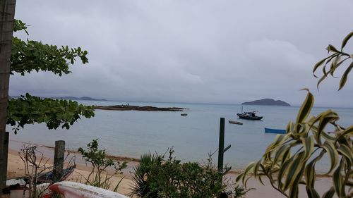 View of calm sea against cloudy sky