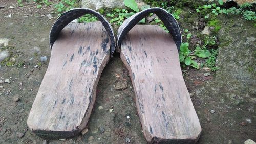 High angle view of old shoes on wood