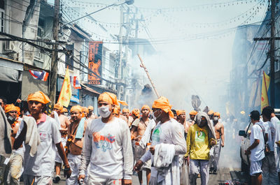 People walking on street in city