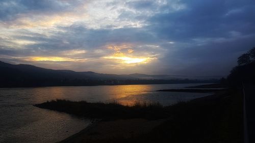 Scenic view of lake against sky during sunset