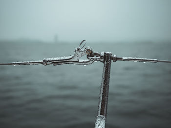 Close-up of rope against cloudy sky