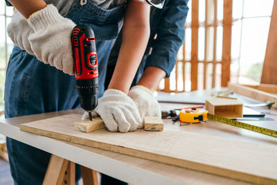 Low section of man working at workshop