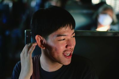 Young man sitting in train