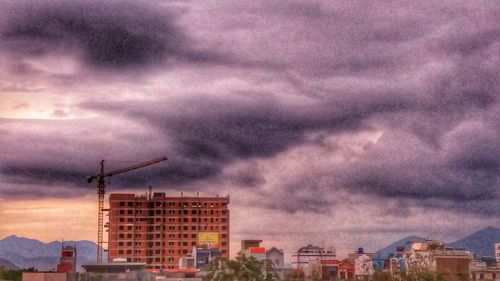 Low angle view of buildings against sky during sunset