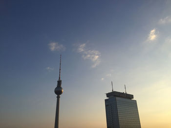 Low angle view of communications tower against sky