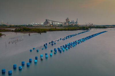 View of bridge over sea against buildings in city