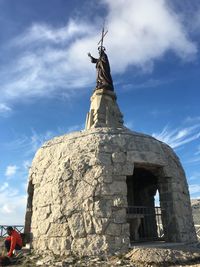 Low angle view of statue against sky