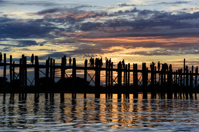 Silhouette of bridge at sunset