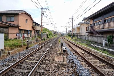 Railway track surrounded by peaceful residences