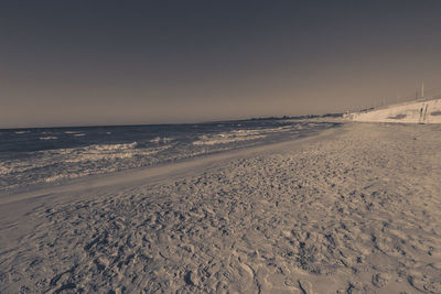 Scenic view of beach against clear sky