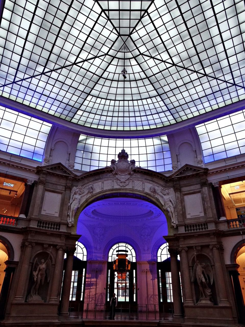 architecture, built structure, low angle view, building exterior, window, indoors, building, glass - material, city, modern, architectural feature, blue, tower, day, no people, directly below, pattern, famous place, capital cities, travel