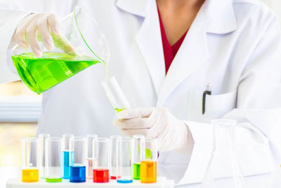 Midsection of woman working in laboratory