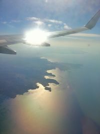 Aerial view of airplane wing over landscape