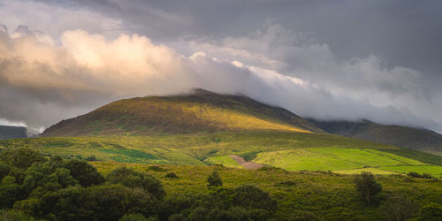 Beautiful sunrise, sunlight illuminating  foothill of carrauntoohil, ring of kerry, ireland