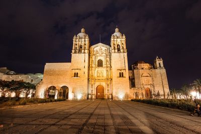 Illuminated cathedral against sky at night