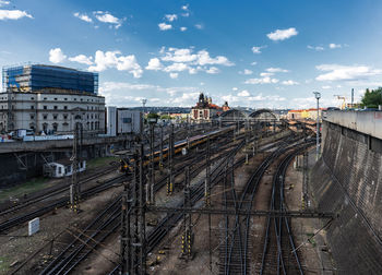 High angle view of railroad tracks in city against sky