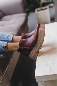 Midsection of woman standing at home