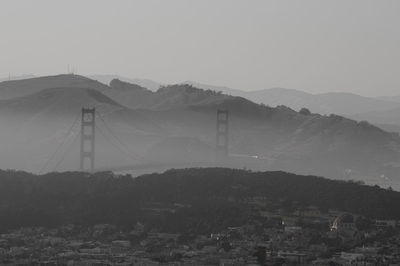 View of landscape with mountain range in background