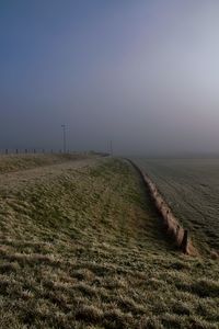 Scenic view of agricultural field against clear sky