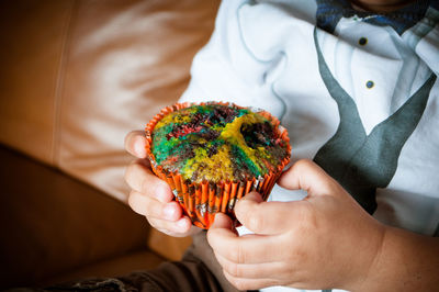 Cropped image of person holding ice cream